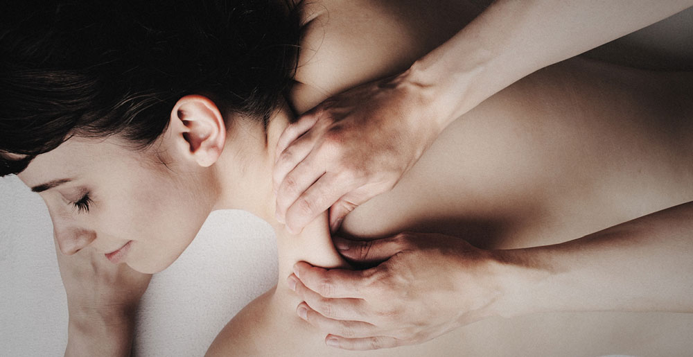 woman receiving back massage