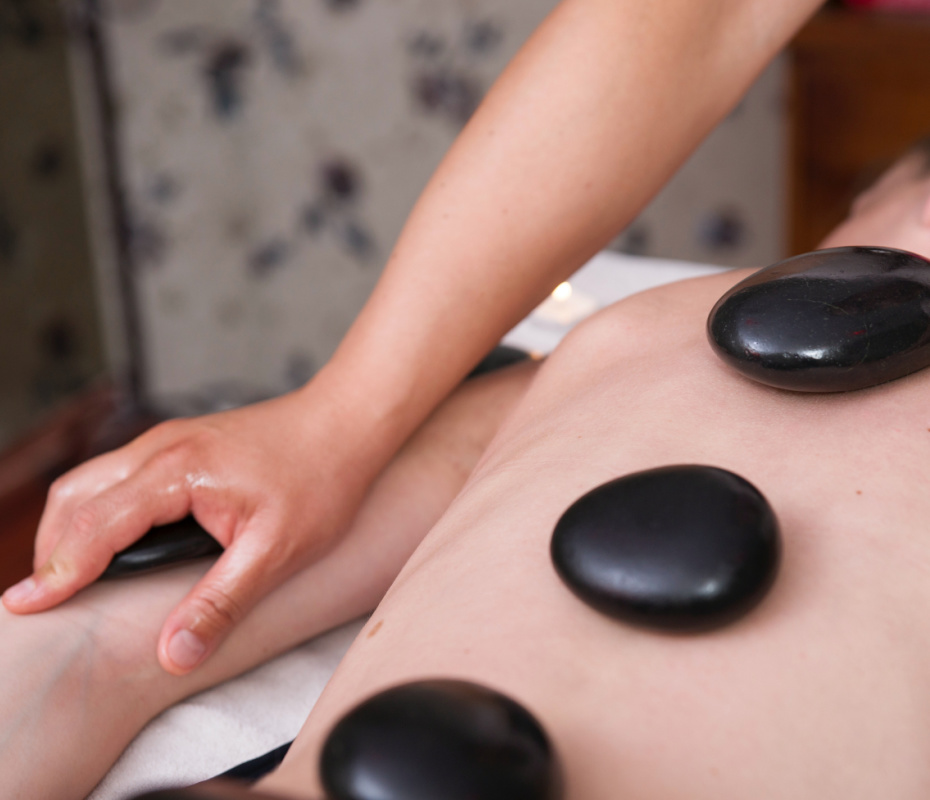 woman receiving hot stone massage